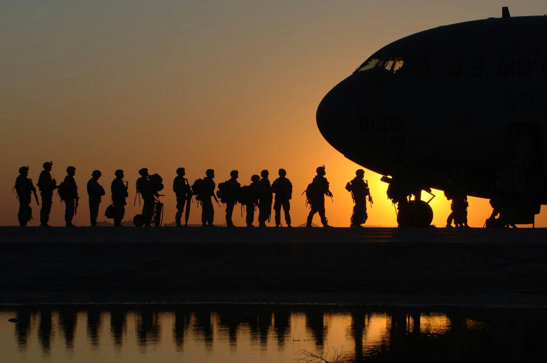 military loading into plane